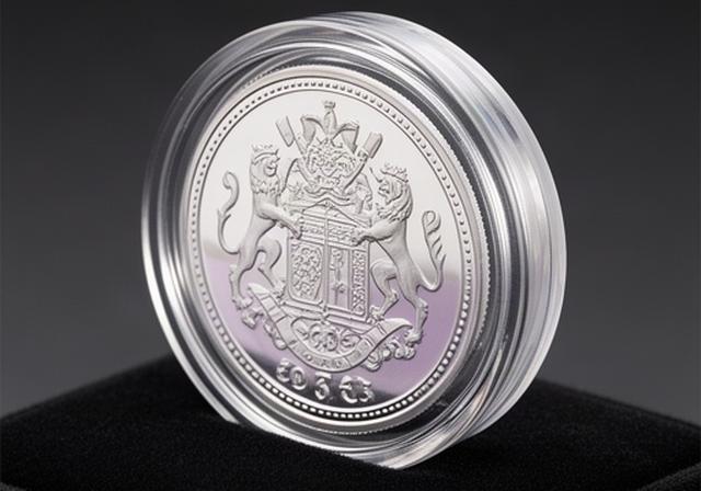 British limited mint commemorative coin in a presentation capsule with silver edge visible