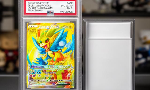 Graded Pokémon trading card in a clear slab beside a card storage box