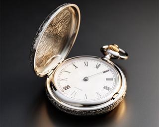 Sterling silver pocket watch with engraved case and open white dial